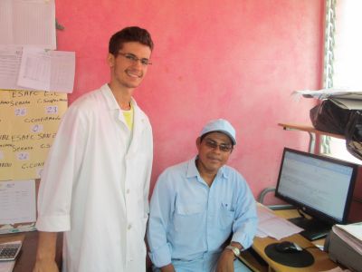 Luke with a health center co-worker
