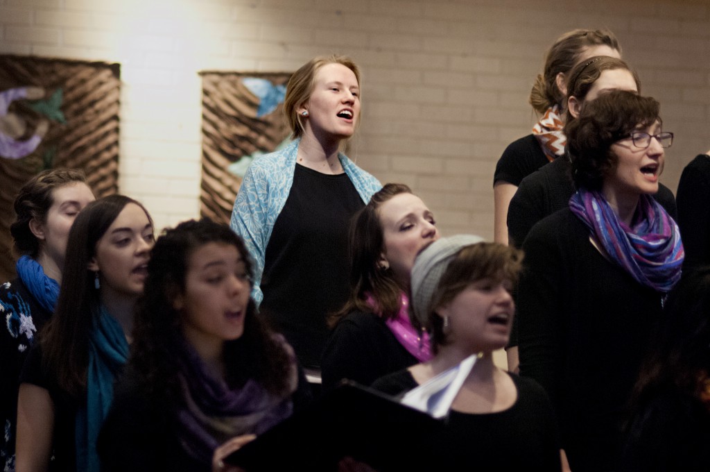 Kate Friesen, a senior English major from Archbold, Ohio, sings with the Goshen College Women’s World Music Choir during a recent performance. (Photo by Brian Yoder Schlabach)