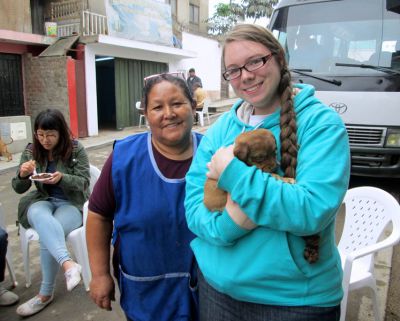 Alicia and Jessica, with one of three puppies recently born at Alicia's house.