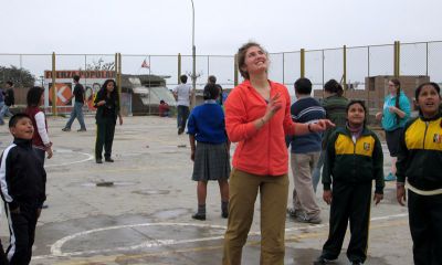 Elizabeth and new friends on the playground.