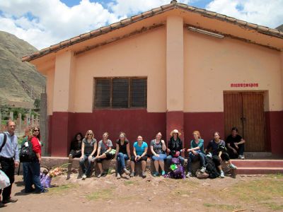Students sit in front of the first Mennonite Church in Peru in the town of Lucre.