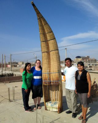 Jessica on the roof of her house with her Santa Rosa host family by her dad's fishing boat.