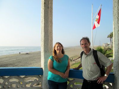 Adriene poses by the ocean with Duane on the walk to her host family home.