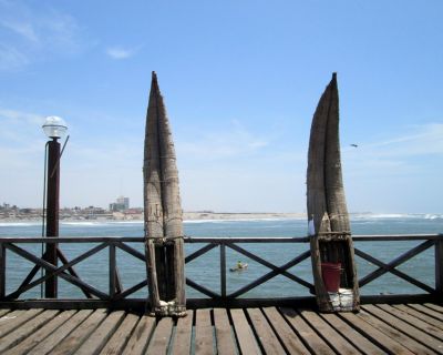 A view of the shore and a boater from the pier in Pimentel.