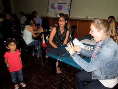 Courtney persuades Sofia to pause for a photo during the farewell fiesta in Lima.