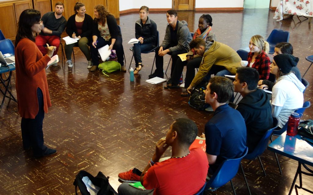 Maria addresses the students