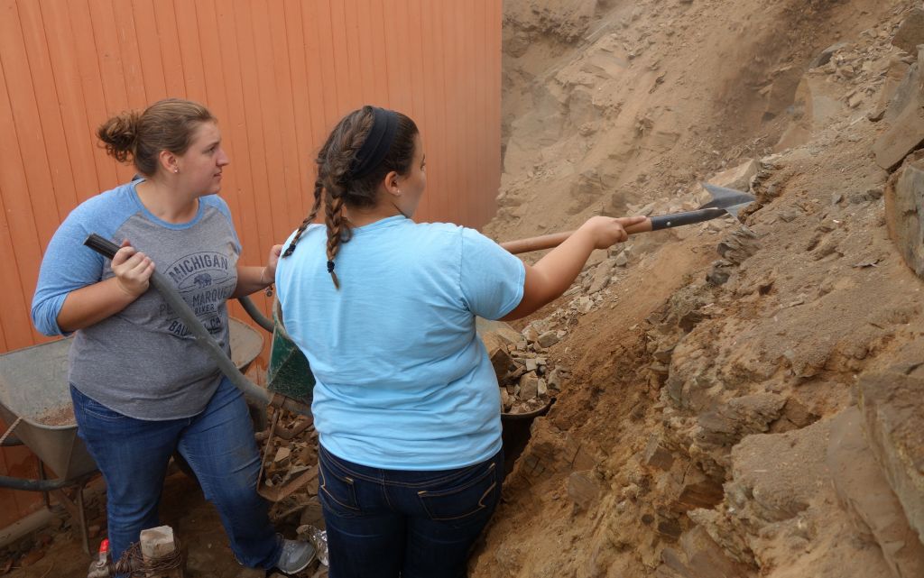 Rachel and Alex pull down the loose dirt