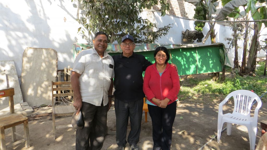Uvaldo, Padre Benjamin, and Uvaldo's wife.
