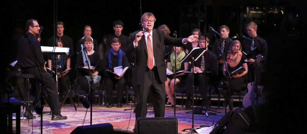Garrison Keillor leads the audience in a hymn during the May 2 live broadcast of A Prairie Home Companion at Goshen College. (Photo by Brian Yoder Schlabach)